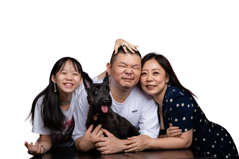 Desmond with his wife Belinda, their daughter and their dog Jojo